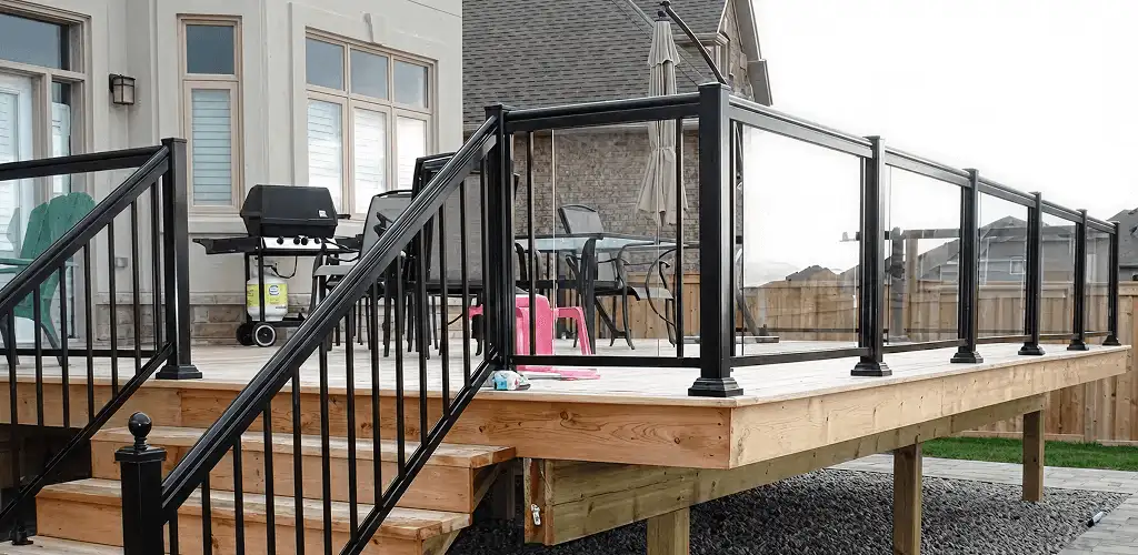 Handrail installation on a deck staircase for safety and code compliance in Miami, FL