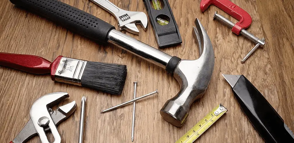 Handyman tools laid out for home repair and maintenance work in Miami, FL